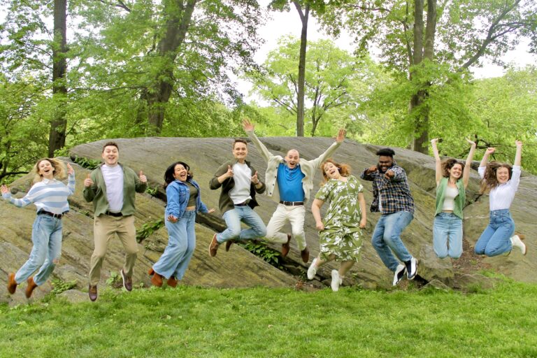 Board members of Amoeba Productions non-profit jumping in a park